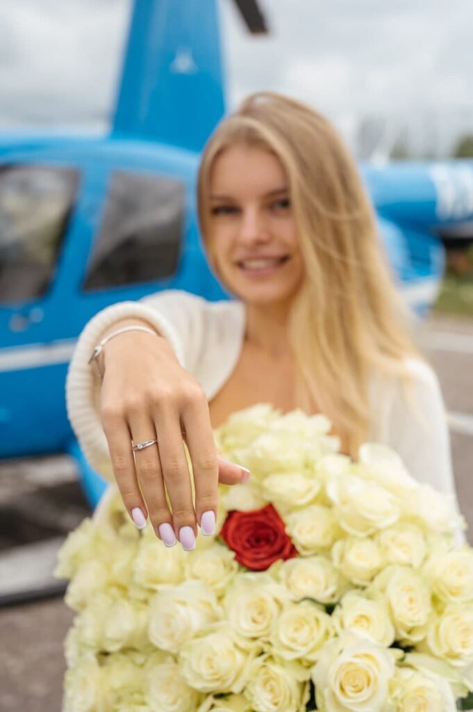 Girl with a ring after a helicopter flight