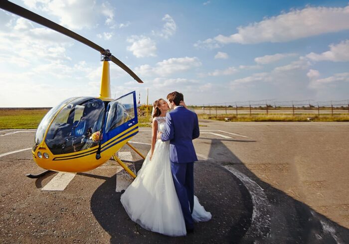A couple of lovers on the background of a helicopter
